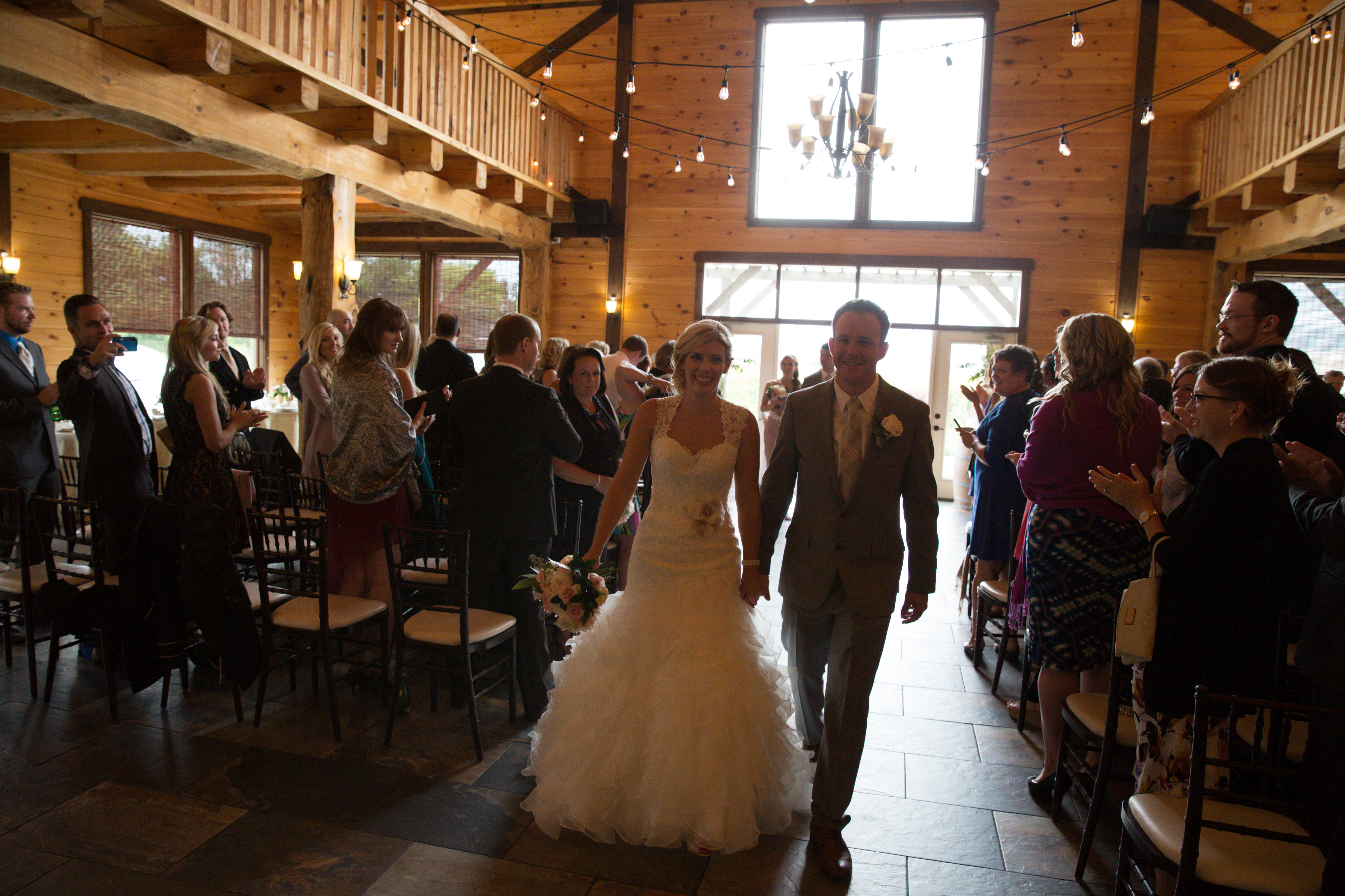 Picture of bride and groom walking down the asile